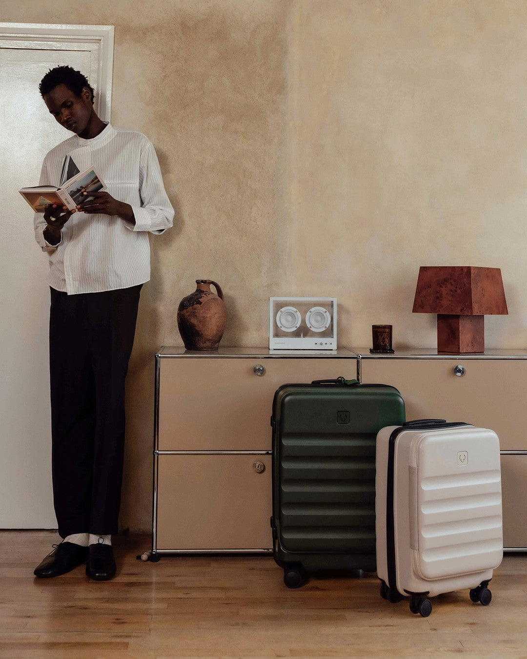 a man standing next to luggage