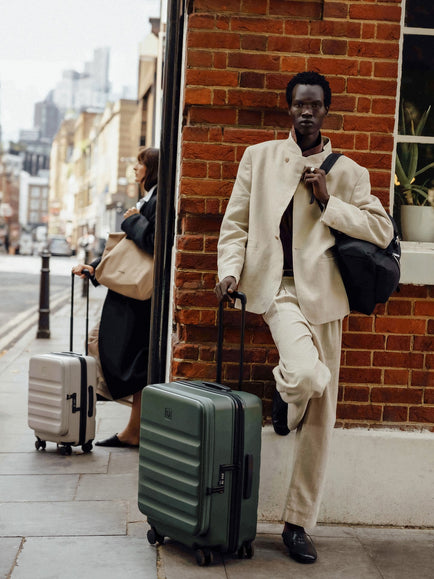 a man in a suit with luggage