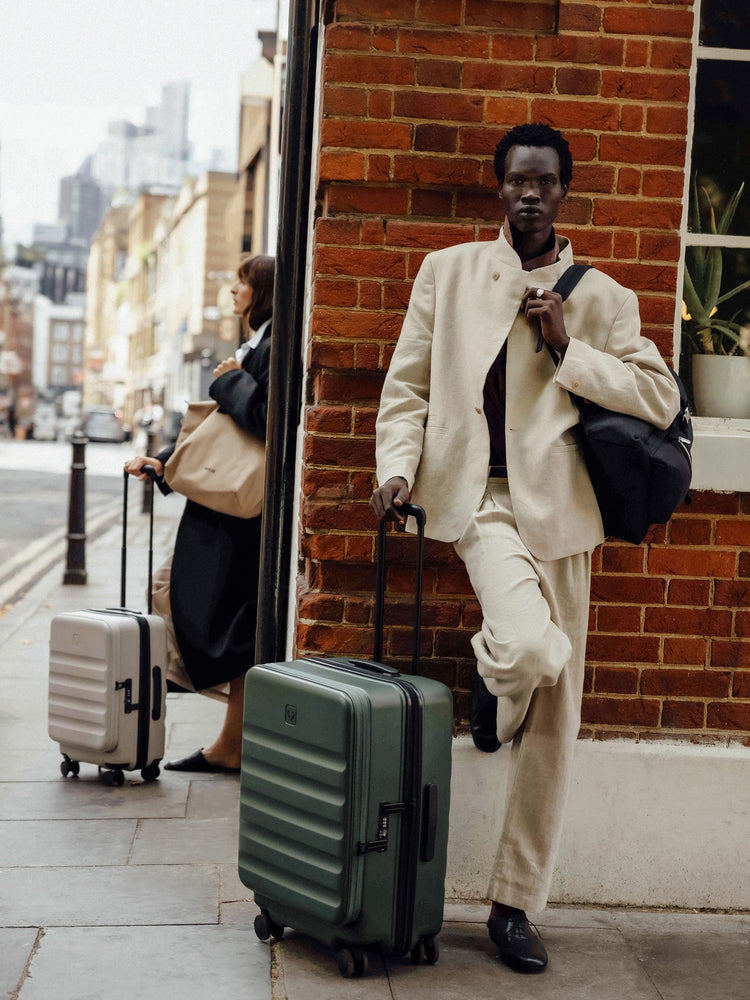 a man in a suit with luggage