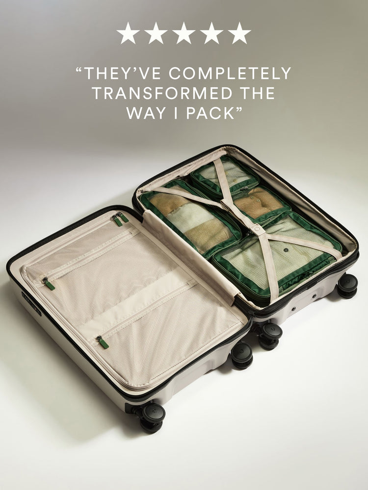 a suitcase with wheels and a few items inside
