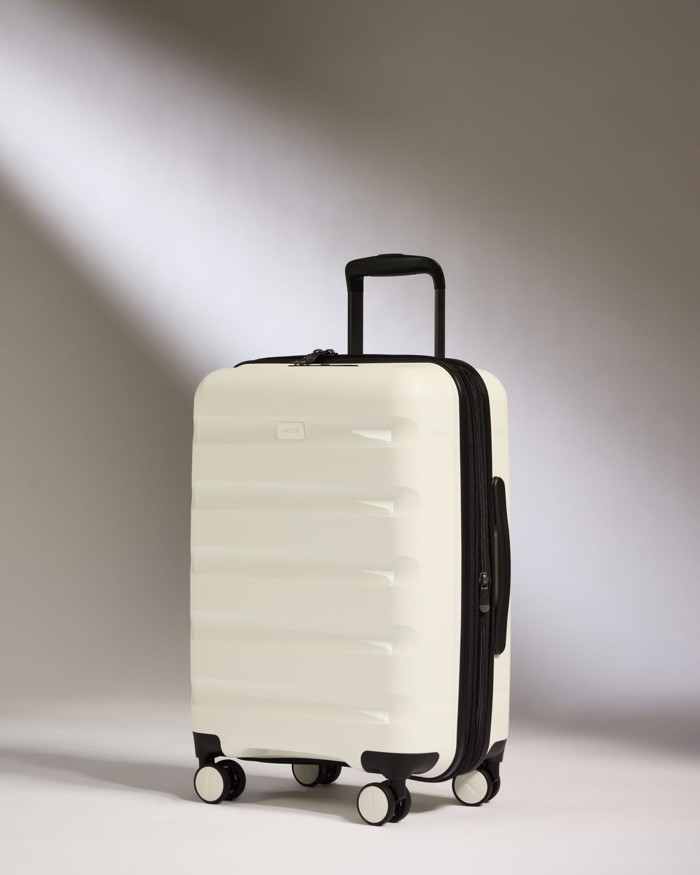 Antler Luggage -  Expandable Cabin Suitcase in White - Logo Stripe - Hard Suitcase - Expander Cabin Expandable Cabin Suitcase White - Logo Stripe | Lightweight Hard Shell Luggage