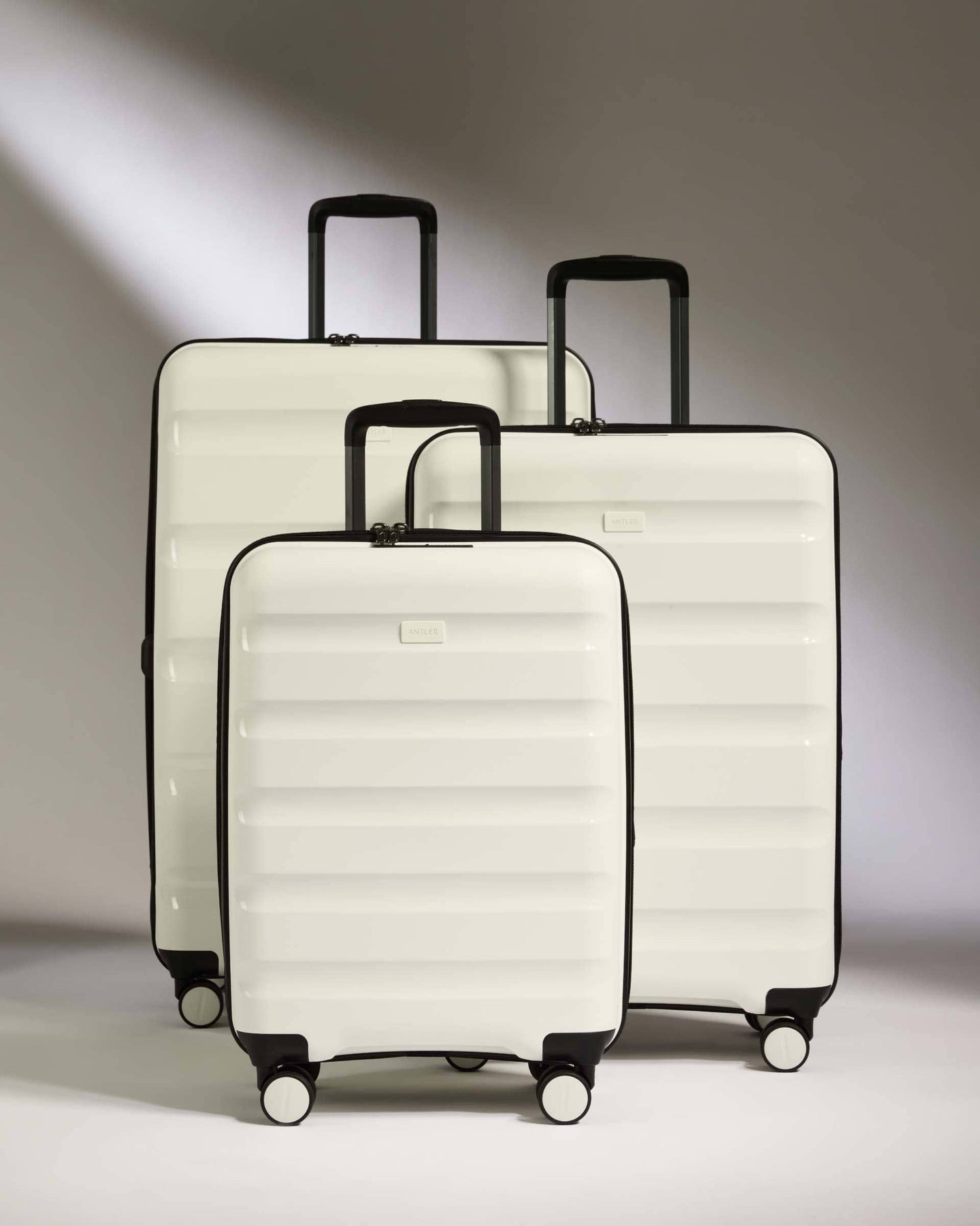 Antler Luggage -  Expandable Cabin Suitcase Set in White - Logo Stripe - Hard Suitcase - Expander Cabin Set Expander Cabin Suitcase Set of 3 Black - Logo Stripe | Lightweight Hard Shell Luggage