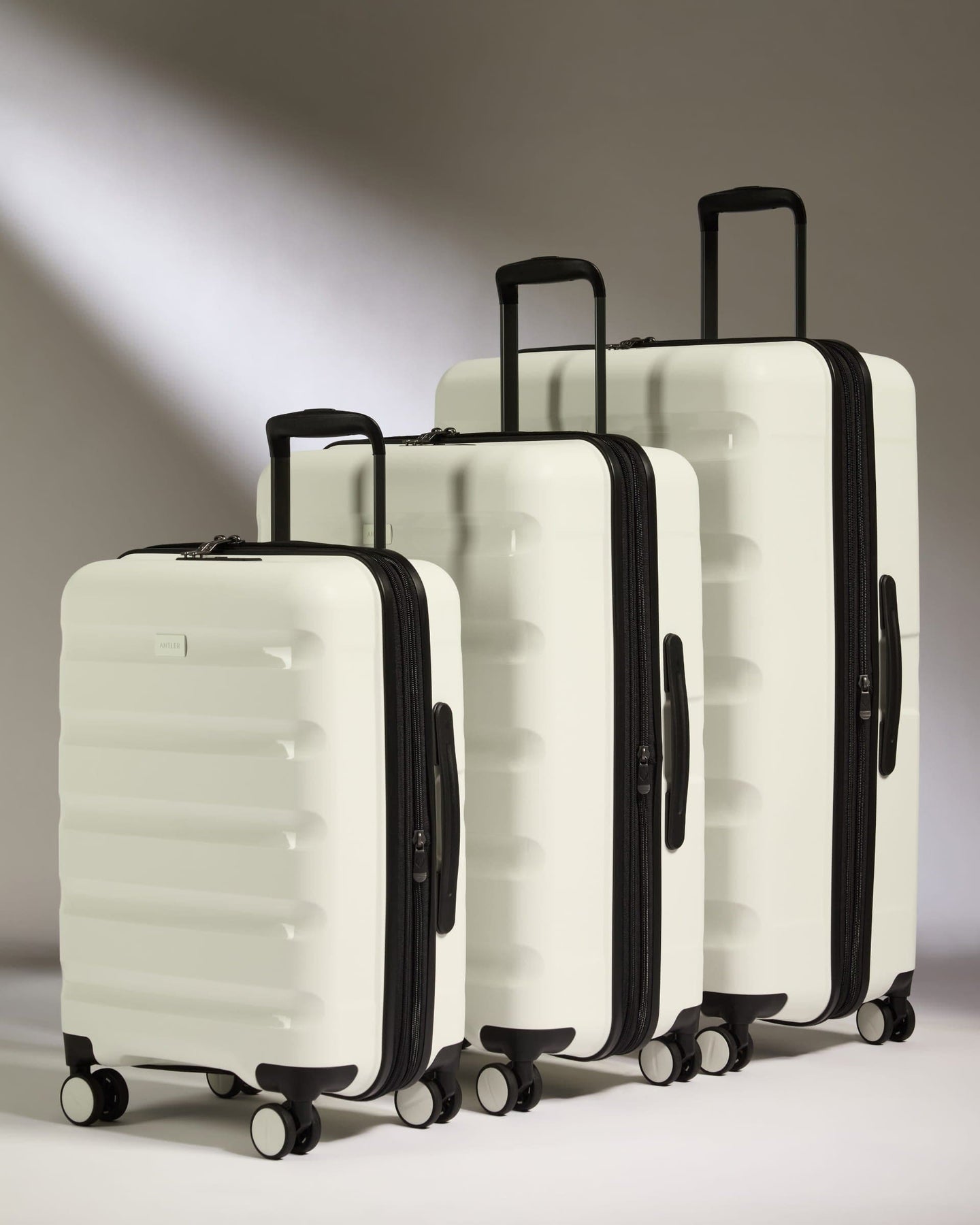 Antler Luggage -  Expandable Cabin Suitcase Set in White - Logo Stripe - Hard Suitcase - Expander Cabin Set Expander Cabin Suitcase Set of 3 Black - Logo Stripe | Lightweight Hard Shell Luggage